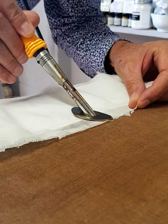 Saviano repairs cloth